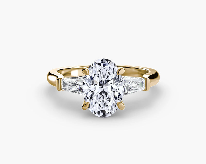 Gold ring with a large diamond on a white background