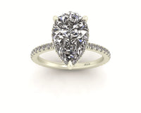 Clasped Pear Halo Pavé Engagement With Diamond Shank