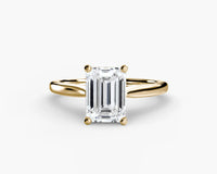 Gold ring with a Emerald diamond on a yellow gold ring solitaire 
