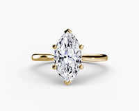 Gold ring with a marquise-shaped diamond on yellow solitaire