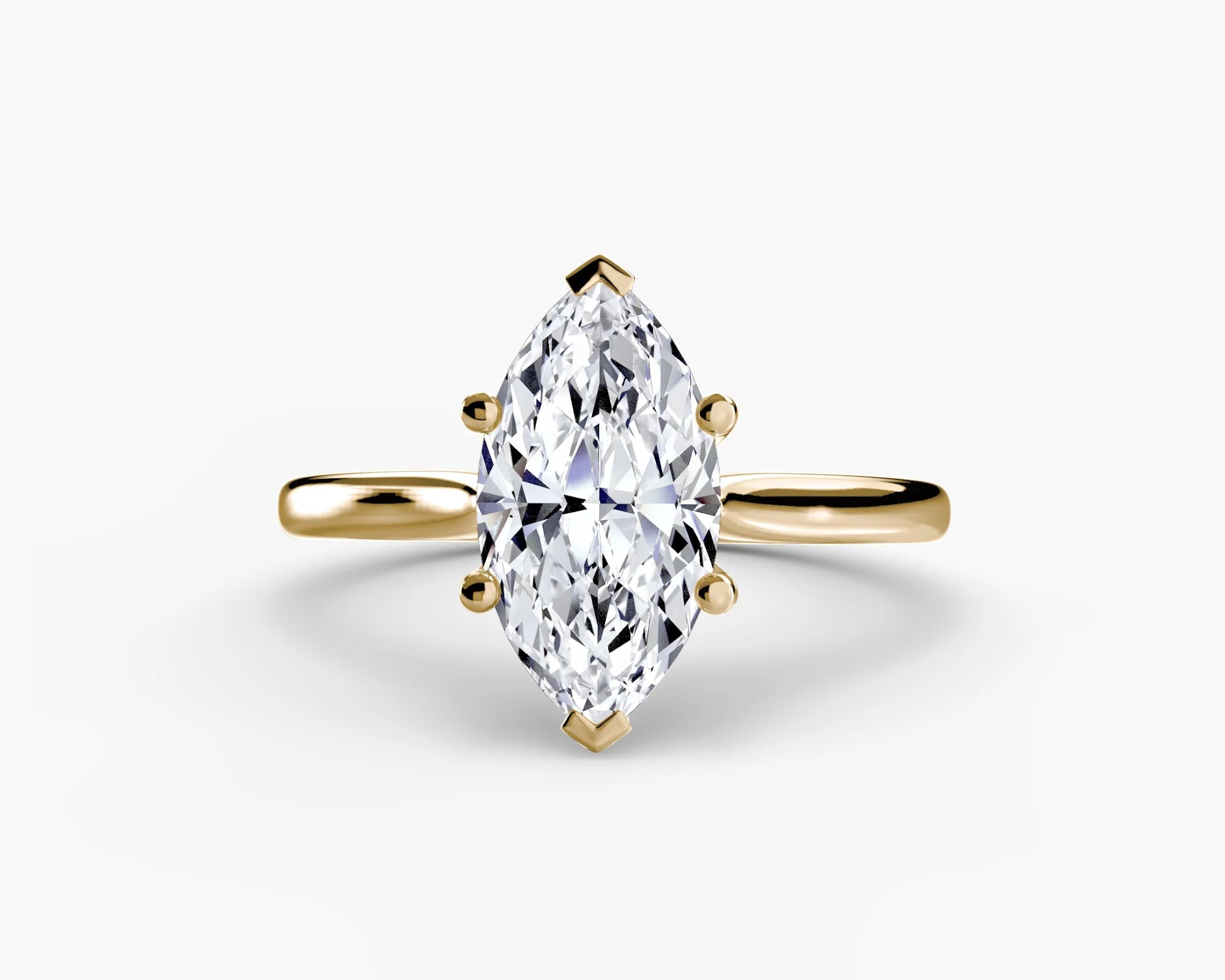 Gold ring with a marquise-shaped diamond on yellow solitaire