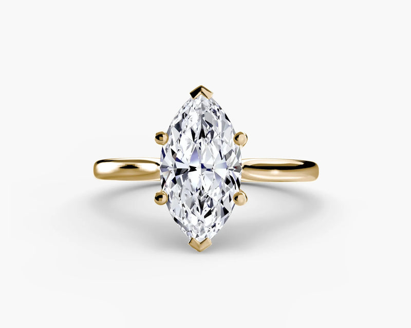 Gold ring with a marquise-shaped diamond on yellow solitaire