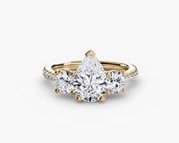 yellow gold ring with three diamond stones on a white background