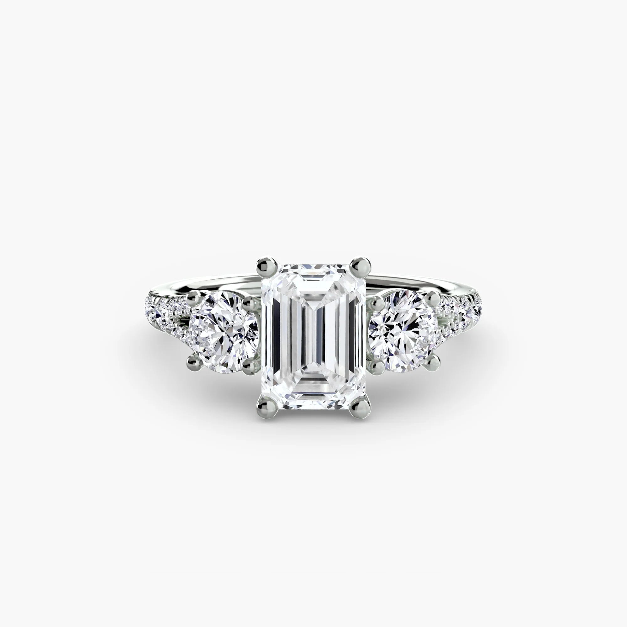 Emerald Split Shank Three Stone Pavé Ring