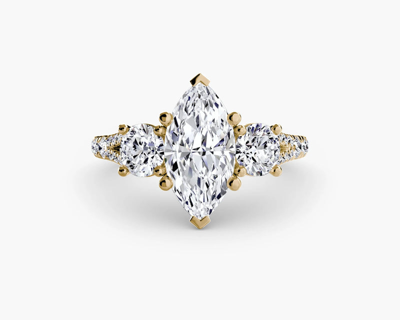 Gold ring with a large central diamond and smaller diamonds on a white background