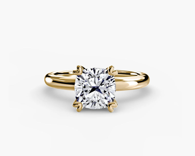 Gold yellow solitaire ring with cushion diamond