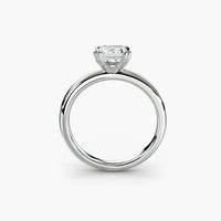 Heart Prong Emerald Solitaire Engagement Ring