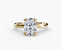 Gold ring with an oval diamond on solitaire engagement ring