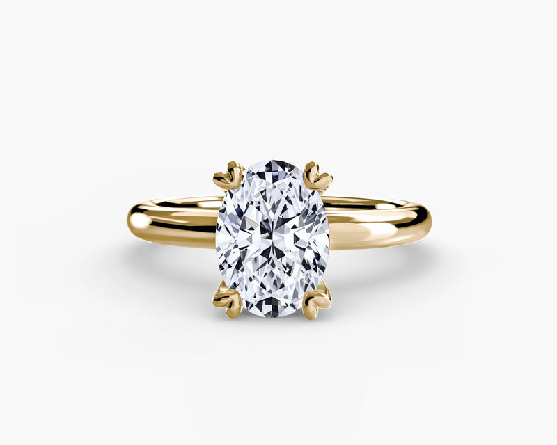 Gold ring with an oval diamond on solitaire engagement ring