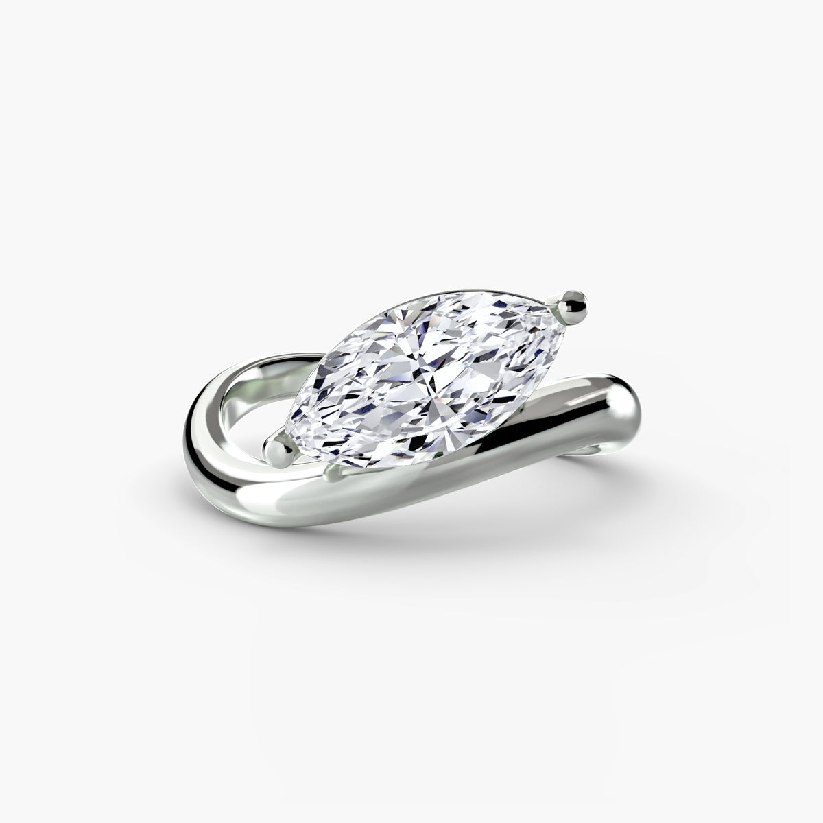 Diamond ring with a pear-shaped gemstone on a white background