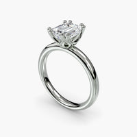 Double Prong Emerald Solitaire ring