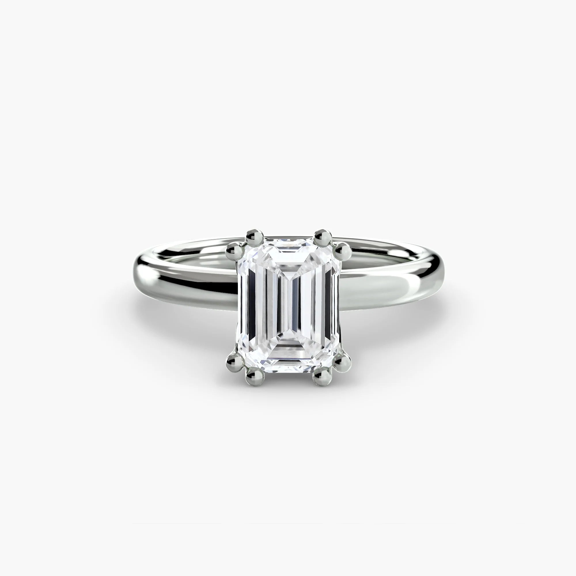 Double Prong Emerald Solitaire ring