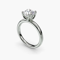 Double Prong Round Solitaire ring
