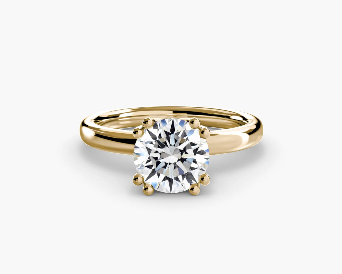 lab round diamond set in yellow gold double prong setting without gallery