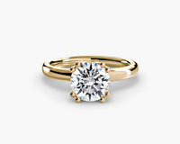 lab round diamond set in yellow gold double prong setting without gallery