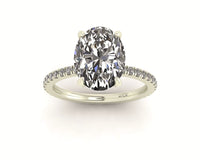 Oval Diamond Set Prongs Engagement Ring with Pavé Band